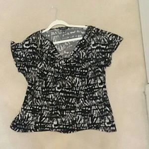 2x black, white, and grey short sleeve shirt